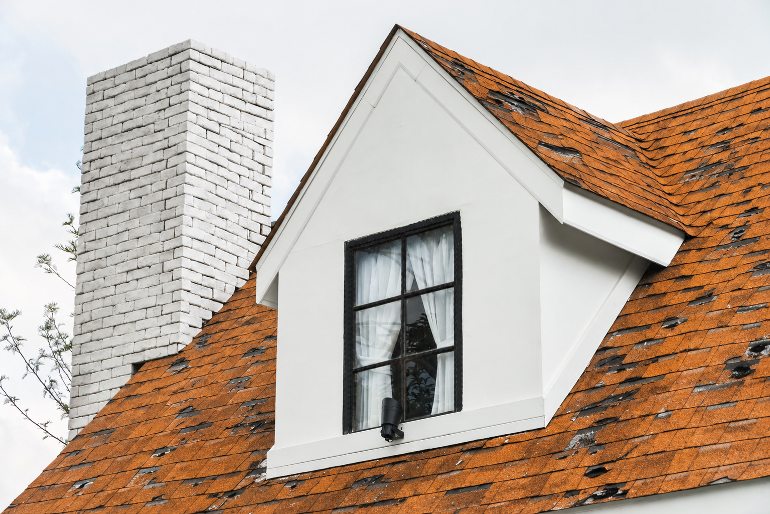 Storm-damaged roof before New Style Roofing restoration